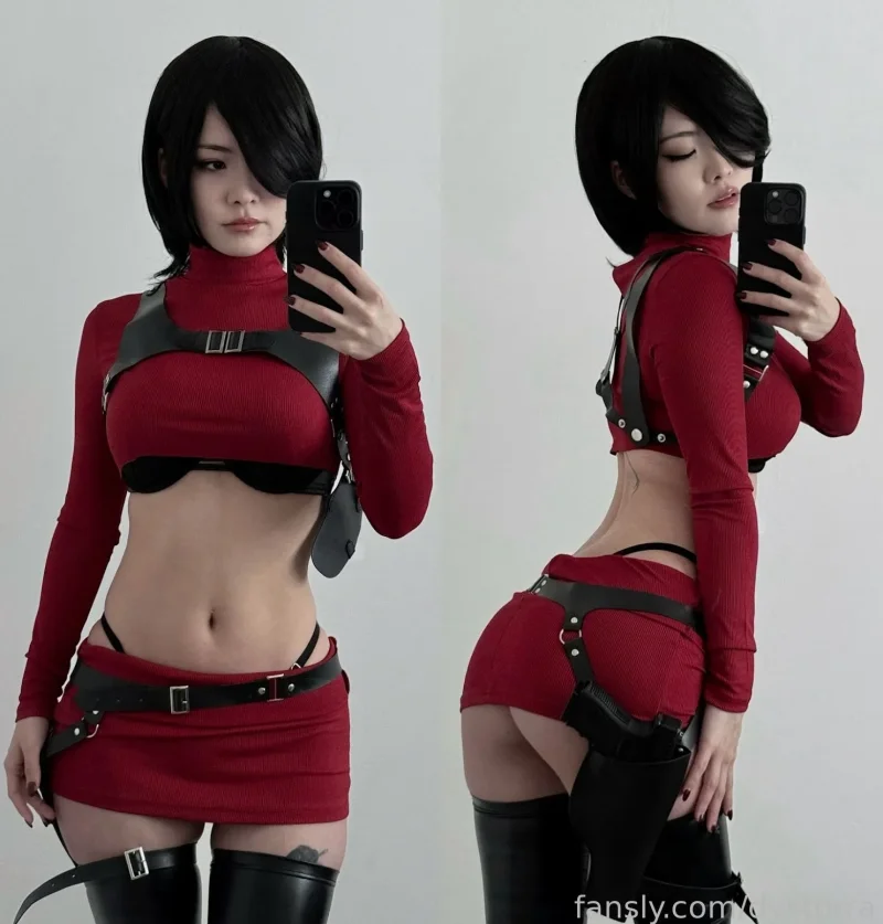 Flirty Torra in red crop top and black harness takes a mirror porn pic showing her ass