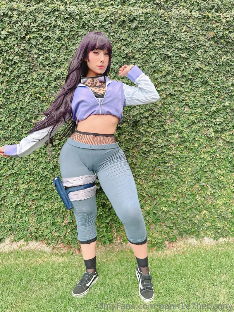 Naughty bonn1e7hebunny in cosplay outfit posing by green hedge, showing off her thicc ass